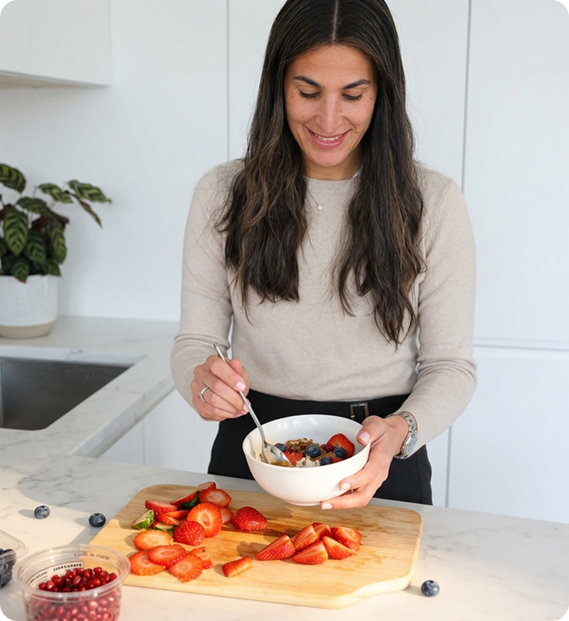 Fresh vegetables in a tote bag with eggs on a wooden kitchen counter